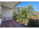 Balcony overlooking a wooded area with a small table and chairs at 1178 Black Walnut Ct, Winter Springs, FL 32708