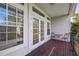 Private balcony with wood decking, wrought iron furniture, and French doors at 1178 Black Walnut Ct, Winter Springs, FL 32708