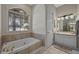 Elegant bathroom with soaking tub, double vanity, and tile flooring at 1178 Black Walnut Ct, Winter Springs, FL 32708