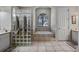 Spa-like bathroom with glass block shower and soaking tub at 1178 Black Walnut Ct, Winter Springs, FL 32708