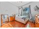 Bright bedroom with hardwood floors and a large window at 1178 Black Walnut Ct, Winter Springs, FL 32708