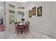 Charming breakfast nook with a round table and four chairs, near kitchen at 1178 Black Walnut Ct, Winter Springs, FL 32708