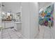 View of kitchen and hallway with colorful artwork at 1178 Black Walnut Ct, Winter Springs, FL 32708