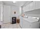 Laundry room with washer, dryer, and extra storage at 1178 Black Walnut Ct, Winter Springs, FL 32708