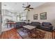 Comfortable living room showcasing hardwood floors and kitchen views at 1178 Black Walnut Ct, Winter Springs, FL 32708