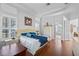 Bright main bedroom with hardwood floors, en-suite bathroom, and walk-in closet at 1178 Black Walnut Ct, Winter Springs, FL 32708