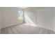 Well-lit bedroom with carpeted floor and large closet at 121 S Cory Dr, Edgewater, FL 32141
