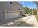 Attached garage with driveway and white door at 1426 Catherine St # 5, Orlando, FL 32801