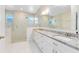 Modern bathroom with double vanity and large shower at 14324 Roxane Dr, Orlando, FL 32832