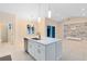 Modern kitchen with island and white cabinets at 14324 Roxane Dr, Orlando, FL 32832