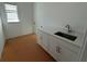 Laundry room with a sink and white cabinets at 15086 Summer Harvest St, Winter Garden, FL 34787