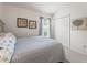 Guest bedroom with a queen bed and closet at 1512 Shale Trail Loop, The Villages, FL 32163