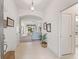 Bright and spacious entryway with tile flooring, leading to the living room at 1512 Shale Trail Loop, The Villages, FL 32163