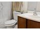 Bathroom with toilet, sink, and brown vanity at 1930 Conway Rd # 2, Orlando, FL 32812