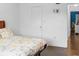 Bedroom with wood floors, a bed, and a door to another room at 1930 Conway Rd # 2, Orlando, FL 32812