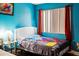 Small bedroom with a bed, lamp, and Spiderman decor at 1930 Conway Rd # 2, Orlando, FL 32812