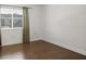 Empty bedroom with wood floors and window with curtains at 1930 Conway Rd # 2, Orlando, FL 32812