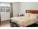 Bedroom with wood floors and a bed with patterned bedding at 1930 Conway Rd # 2, Orlando, FL 32812