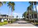 Gated community entrance with palm trees and landscaping at 1930 Conway Rd # 2, Orlando, FL 32812