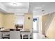 Bright dining area with wooden table and white chairs near kitchen at 1930 Conway Rd # 2, Orlando, FL 32812