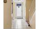 Clean entryway with tile floors and white front door at 1930 Conway Rd # 2, Orlando, FL 32812