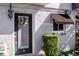 Front door entrance with wreath, window awning, and well-manicured shrubbery at 1930 Conway Rd # 2, Orlando, FL 32812