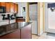 Modern kitchen with stainless steel appliances and granite countertops, stackable washer/dryer at 1930 Conway Rd # 2, Orlando, FL 32812