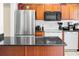 Modern kitchen with stainless steel appliances and granite countertops at 1930 Conway Rd # 2, Orlando, FL 32812