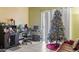 Living room with home office space, Christmas tree and access to patio at 1930 Conway Rd # 2, Orlando, FL 32812