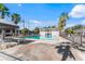 Community pool area with palm trees and lounge chairs at 1930 Conway Rd # 2, Orlando, FL 32812