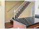 Indoor staircase with white railing leading to the upper level at 1930 Conway Rd # 2, Orlando, FL 32812