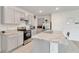 Modern kitchen with gray cabinets, granite countertops, and stainless steel appliances at 219 Eagleview Loop, Davenport, FL 33837