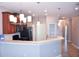 Open kitchen with breakfast bar, stainless steel appliances, and wood cabinets at 2825 Attwater Loop, Winter Haven, FL 33884