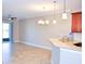 Modern kitchen features tile floors and a breakfast bar at 2825 Attwater Loop, Winter Haven, FL 33884