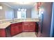 Updated kitchen with stainless steel appliances and ample wood cabinetry at 2825 Attwater Loop, Winter Haven, FL 33884