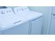 Bright laundry room with white washer and dryer at 2825 Attwater Loop, Winter Haven, FL 33884