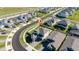 An aerial view showcasing a house with a pool in a neatly planned community at 4381 Davos Dr, Clermont, FL 34711