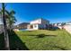Large grassy backyard with pool, patio and trampoline at 4381 Davos Dr, Clermont, FL 34711