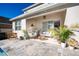 Relaxing patio with seating area, pool view, and lush landscaping at 4381 Davos Dr, Clermont, FL 34711