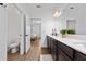 Bathroom with double vanity and view of bedroom at 4381 Davos Dr, Clermont, FL 34711