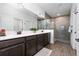 Double vanity bathroom with large shower and modern fixtures at 4381 Davos Dr, Clermont, FL 34711
