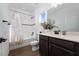 Clean bathroom with tub, shower, and modern vanity at 4381 Davos Dr, Clermont, FL 34711