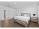 Spacious bedroom with a king-size bed and ensuite bathroom access at 4381 Davos Dr, Clermont, FL 34711