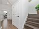 Bright hallway with tile flooring, leading to other rooms and stairs at 4381 Davos Dr, Clermont, FL 34711