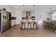 Modern kitchen featuring stainless steel appliances and an island with seating at 4381 Davos Dr, Clermont, FL 34711