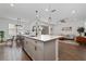 Open concept kitchen with a large island, stainless steel appliances, and breakfast nook at 4381 Davos Dr, Clermont, FL 34711