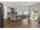 Open concept kitchen with an island, stainless steel appliances, and access to the backyard at 4381 Davos Dr, Clermont, FL 34711