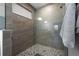 Spacious shower with patterned floor and glass enclosure at 4381 Davos Dr, Clermont, FL 34711