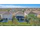 Aerial view of home with pool and lush landscaping at 471 Lasso Dr, Kissimmee, FL 34747