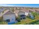 Aerial view of houses with community pool at 471 Lasso Dr, Kissimmee, FL 34747